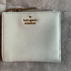 slightly worn kate spade wallet